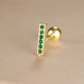 Detailed macro view of gold-plated bar earring with row-set green zircons and ball screw back - Inlaid Bar Style (Y26032-8)