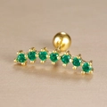 Detailed close-up of curved gold ear stud with seven green zircon stones and screw back ball - Seven Stone Arc Inlaid Style (Y26032-13)