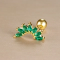 Macro shot of gold stainless steel tragus stud with green marquise stones and screw ball back - Seven Marquise Fan Inlaid Style (Y26032-14)