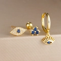 Detail van driedelige Evil Eye oorbellen set in goud met blauwe zirkonia stenen - Boze Oog Kogel Sluiting 3-Delige Set (Y26036-3) / Goud