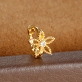Macro shot of gold floral huggie hoop earring with milgrain detail and zircon center - Hollow Flower Style (Y20487-8) / 1 Piece / Gold