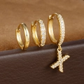 Detail van een driedelige gouden oorbellenset met S925-zilvermerk en fonkelende zirkonia-stenen - Letter X Stijl (Y26056-X)
