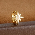 Macro shot of gold star-shaped ear cuff featuring inlaid cubic zirconia on leather base - Eight-pointed Star Style (Y20487-17) / 1 Piece / Gold
