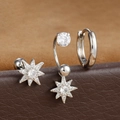 Dettaglio macro di tre orecchini argento con perni a stella in zircone e piccolo cerchio - Forma di Ottagramma - Argento