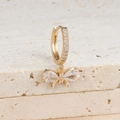 Macro shot of gold bow earrings featuring teardrop zircon crystals on stone background - Bow Dangle (Y76019) / Gold-White