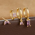 Detailed macro view of four-piece gold earring set with purple marquise zircons - Gold Purple Geometric Floral Style (E1410) / Gold