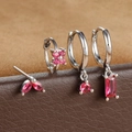Macro shot of silver earring set featuring deep pink zircon stones in various cuts - Silver Rose Red Geometric Floral Style (E1410) / Silver