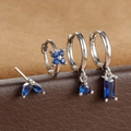 Macro detail of silver ear studs set with sapphire blue marquise and round gemstones - Silver Dark Blue Geometric Floral Style (E1410) / Silver