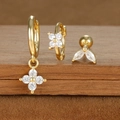 Macro shot of 18K gold plated S925 silver earrings set with sparkling zircon details - Gold