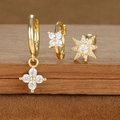 Macro view of gold-plated S925 silver earring set with zircon star and moon charms - Flower and Octagonal Star Style (E1610-7) / Gold
