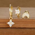 Detailed macro view of S925 sterling silver stamp on gold zircon star and moon earrings set - Gold