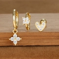 Macro shot of 18K gold plated earring set with zircon stars and hearts on wood - Flower and Heart Stud Style 2 (E1610-16) / Gold