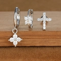 Detailed close-up of zircon star and moon earring set featuring a cross stud in silver - Silver