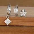 Detail of silver earring set featuring zircon flowers and moon on a brown velvet surface - Four-leaf Flower and Five-petal Stud Style (E1610-12) / Silver
