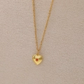 Collier médaillon coeur vintage doré avec pierre de naissance orange et détails soleil - Janvier