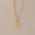 Golden heart locket necklace with green center gemstone and elegant sunburst engraving - May