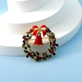 Detail of Christmas wreath brooch with enamel leaves, red bell, and sparkling rhinestones - Wreath Bell Style A