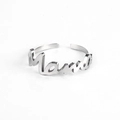 Close-up of adjustable silver Mama letter ring with minimalist script design - Ring / Silver