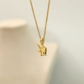 Macro detail of gold champagne bucket pendant with red crystal and white rhinestones - Ice Beer Bucket Necklace