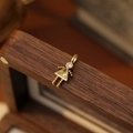 Golden girl-shaped pendant charm featuring a large yellow triangular zircon stone - November Girl