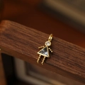 Gold girl pendant with blue triangle gemstone and white zircon for custom jewelry - March Girl