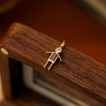 Golden articulated boy girl pendant with rectangle red gemstone and white zircon - January Boy
