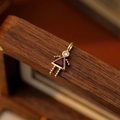 Golden boy girl pendant with red triangle gemstone and sparkling white zircon crystal - July Girl