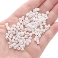 5mm white glass seed beads for DIY handmade jewelry crafting shown in palm of hand - White Approximately 5x5mm Pore Size Approximately 1mm 10g/pack Approximately 100 Pieces.