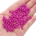 Vibrant purple 5mm seed beads in hand to show size for DIY jewelry making - Purple-red Approximately 5x5mm Pore Diameter Approximately 1mm 10g/pack Approximately 100 Pieces
