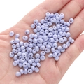 Lavender 5mm glass seed beads for DIY jewelry making displayed on a palm for scale - Blue-purple Approximately 5x5mm Pore Size Approximately 1mm 10g/pack Approximately 100 Pieces