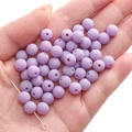 8mm lilac purple matte acrylic beads for DIY jewelry making held in palm of hand - Light Purple