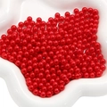 Lustrous round red ABS pearl beads for DIY crafts displayed on a white decorative plate - 3mm (10000 Pieces/Pack) / Red