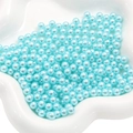 Sky blue luster faux pearls in white dish for DIY jewelry and decorative fillers - Aqua
