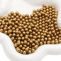 Polished matte golden ABS round loose beads for DIY crafts and decor in white ceramic bowl - Matte Gold