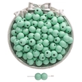 Mint green matte wooden round beads for DIY jewelry making displayed on a small tray - 10mm Hole Approx 3mm / 50 Pieces / Teal