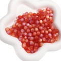 Vibrant gradient orange resin cat-eye round beads in a white star-shaped tray for DIY jewelry - Red Iridescent Matte
