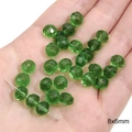 Green 8x6mm faceted glass crystal beads for DIY jewelry making held in hand - Transparent Wheel Bead / 8x6mm / Light Green