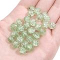 Macro detail of 8-10mm light green crackle glass beads for DIY jewelry making - Clear Cracked Green