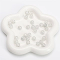 8mm white cracked glass round beads with ice texture inside a floral ceramic tray - Gray