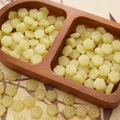 Light green flower glass beads for DIY jewelry making with delicate petal carvings - Yellow Plum Blossom
