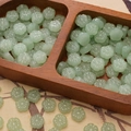 Translucent pale green plum blossom glass beads for DIY jewelry and crafts - Light Green Plum Blossom Bead