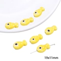 Yellow fish shaped ceramic beads with white polka dots for DIY jewelry 19x11mm - Spotted Fish