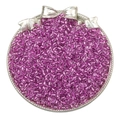 Vibrant purple glass seed beads displayed in a silver bow-motif decorative tray - Silver Rose Purple