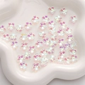 Pink AB coated cherry blossom beads for DIY jewelry making in a white ceramic dish - 11mm (1mm Hole/10 Pcs) / AB Color