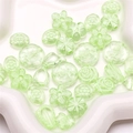 Macro shot of assorted light green acrylic flower and leaf beads for DIY jewelry making - 20g/Pack (Approx. 25-30 Pieces) / Green