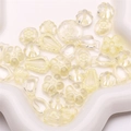 Macro detail of mixed yellow acrylic DIY beads featuring floral, bow, and heart shapes - 20g/Pack (Approx. 25-30 Pieces) / Beige