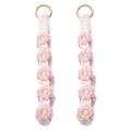 Pink and yellow woven daisy keychains with golden metal rings in a two-piece set - Light Pink
