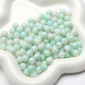 Light green marbled glass beads for DIY jewelry making in a white ceramic dish - 30 Pieces/Pack (8mm) / Light Green