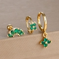 Detailed view of three emerald green clover earrings in a gold setting on a brown stand - Gold-Green (Y26109-4)