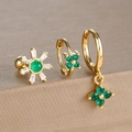 Detail of three-piece gold clover earring set with green and white gemstones on a brown surface - Gold-Green (Y26109-6)